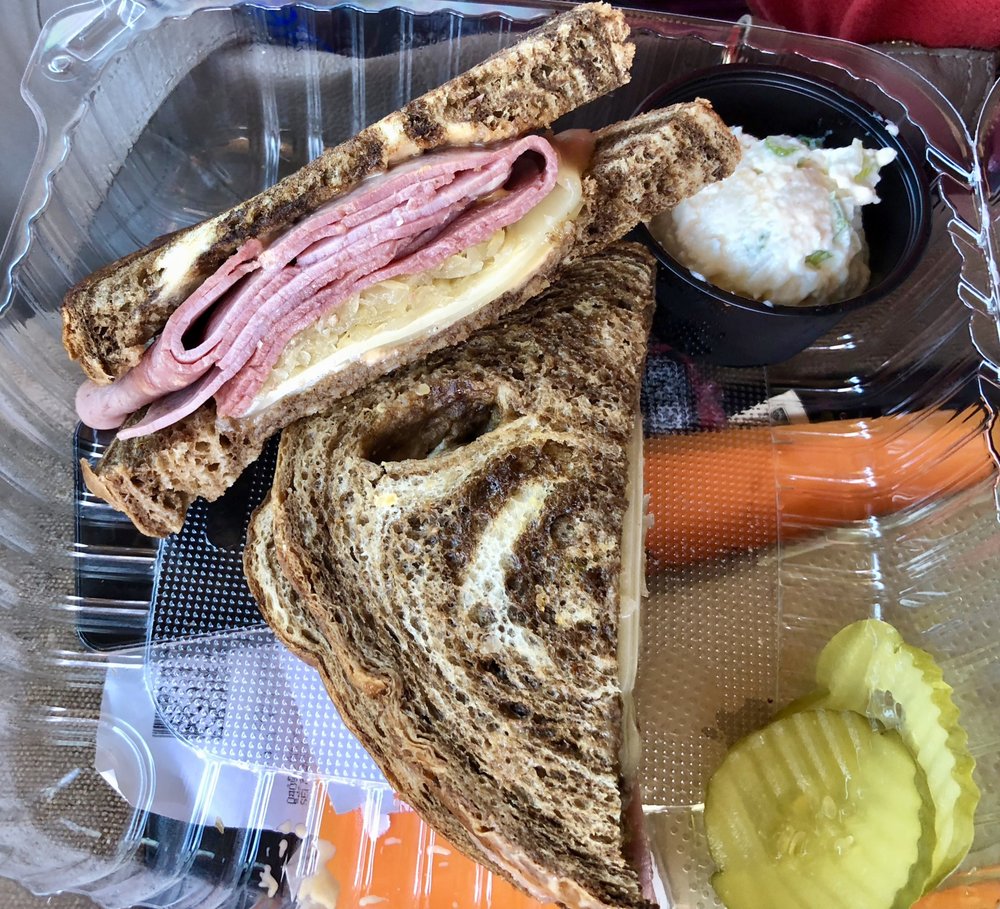 A stacked deli sandwich on marbled rye at Nana's